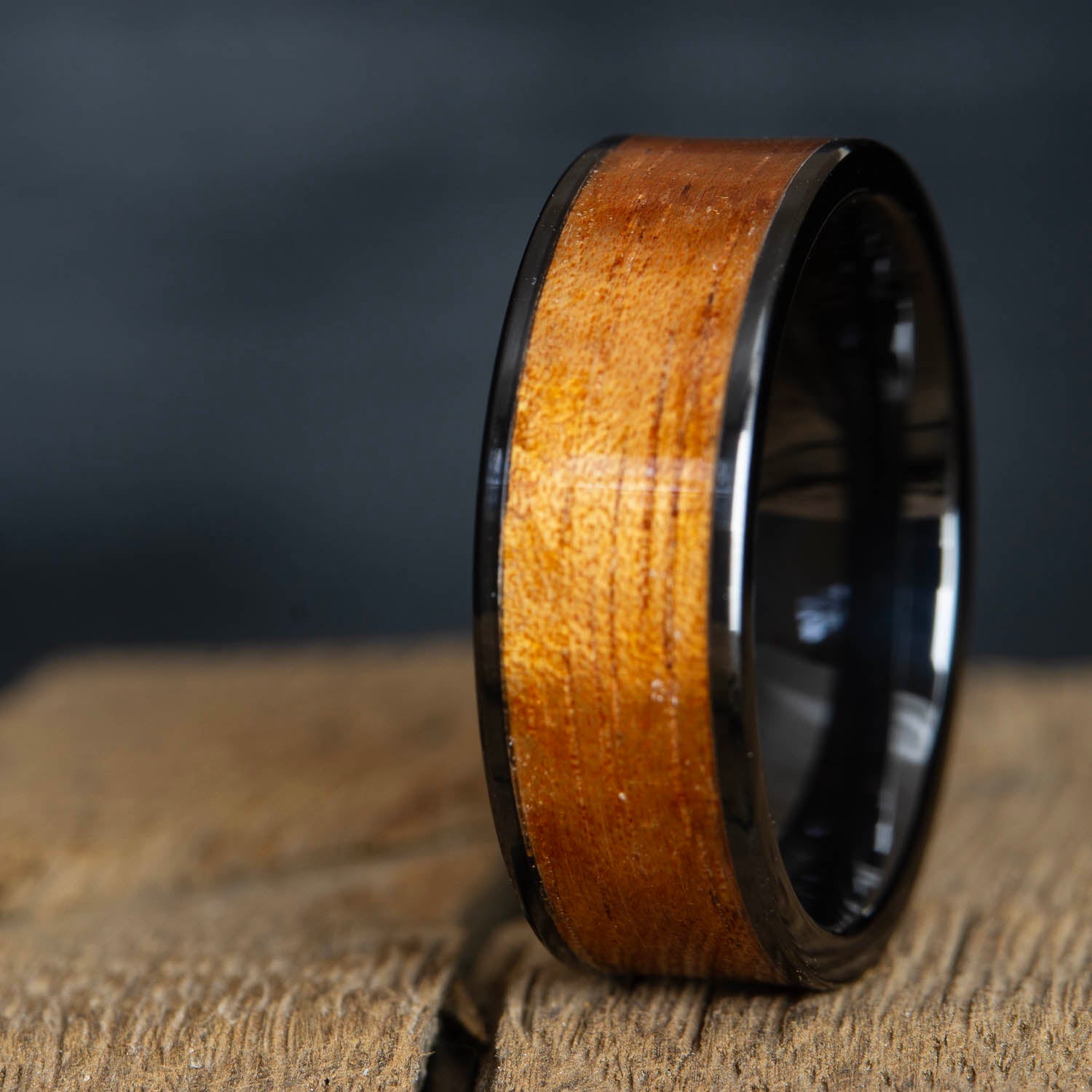 Black ceramic wedding band with Koa wood inlay