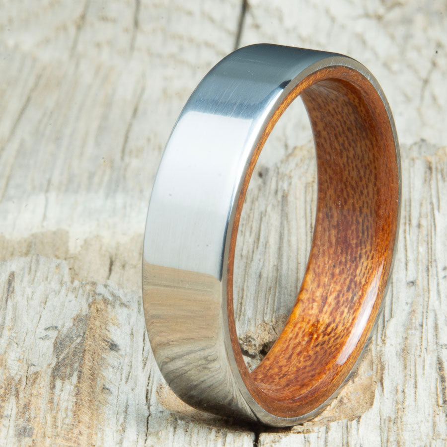 Classic titanium wood ring with Acacia wood interior. Unique titanium and wood wedding rings made by Peacefield Titanium.