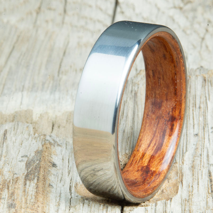 Classic titanium wood ring with Bubinga wood interior. Unique titanium and wood wedding rings made by Peacefield Titanium.