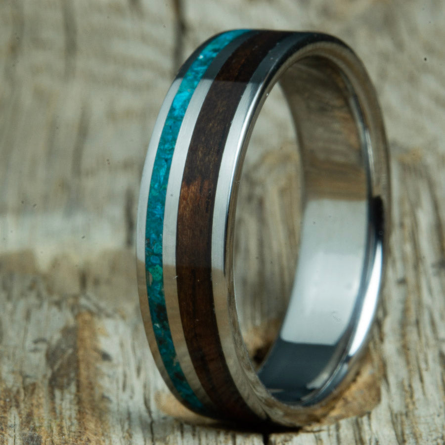 handcrafted Ebony wood and chrysocolla stone inlay on titanium ring. Custom titanium rings by Peacefield Titanium.