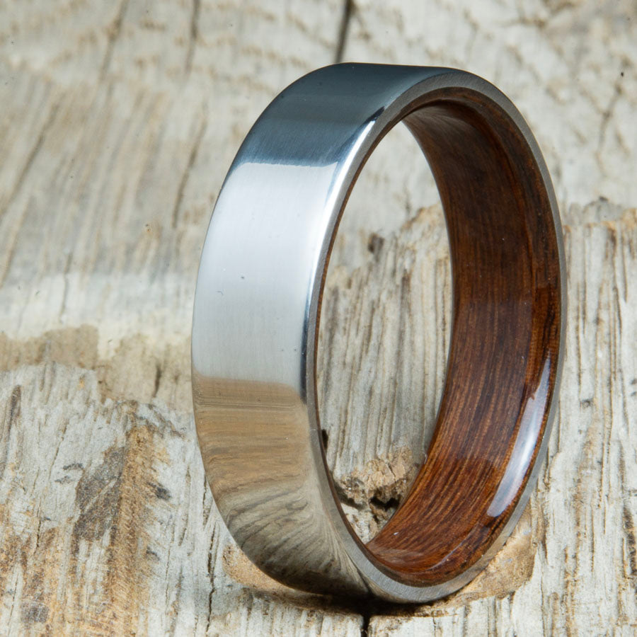 Classic mens Rosewood wood wedding band with polished titanium. Custom wood rings made by Peacefield Titanium