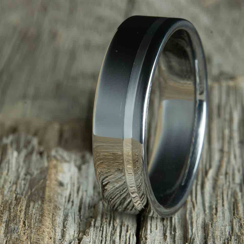 polished titanium wedding band with silver inlay pinstripe