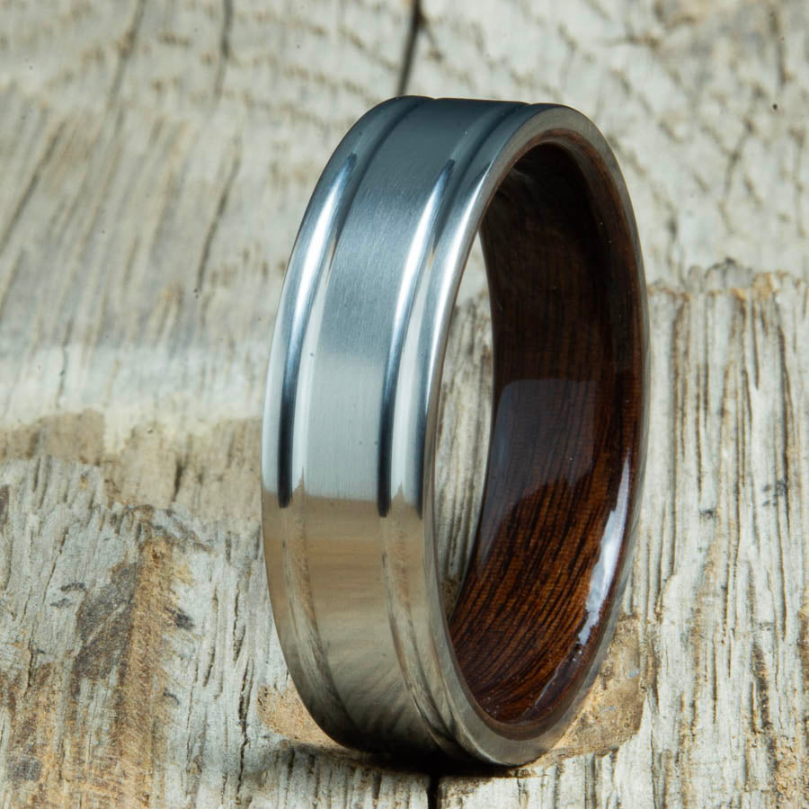 Double groove satin titanium wood ring with Rosewood interior. Unique handcrafted wedding rings made by Peacefield Titanium