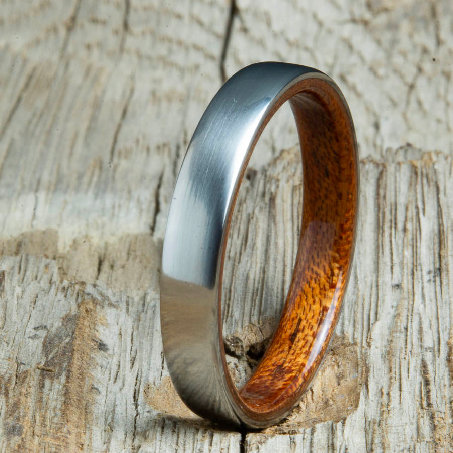 Acacia lined womens wood ring with satin titanium. Custom handcrafted womens wooden rings are made by Peacefield Titanium