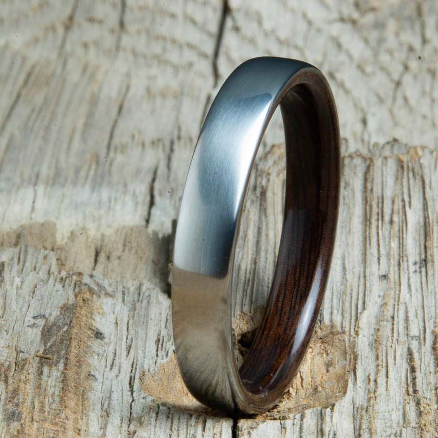 Rosewood lined womens wood ring with satin titanium. Custom handcrafted womens wooden rings are made by Peacefield Titanium