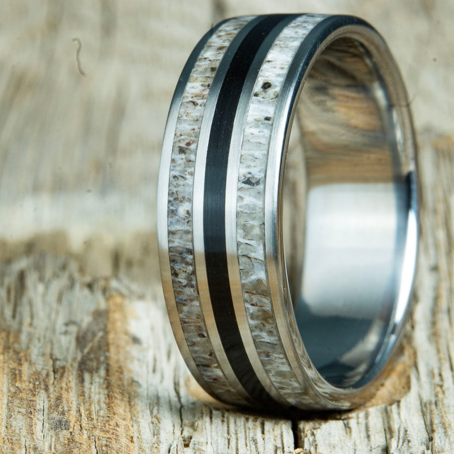 custom Antler and volcanic rock inlay ring. Unique mens ring with Deer antler inlay and volcanic rock sand custom made by Peacefield Titanium in every finger size from 5 to 14 and widths from 8mm to 10mm