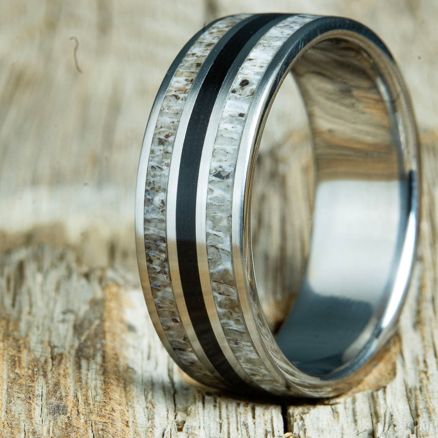 custom Antler and volcanic rock inlay ring. Unique mens ring with Deer antler inlay and volcanic rock sand custom made by Peacefield Titanium in every finger size from 5 to 14 and widths from 8mm to 10mm
