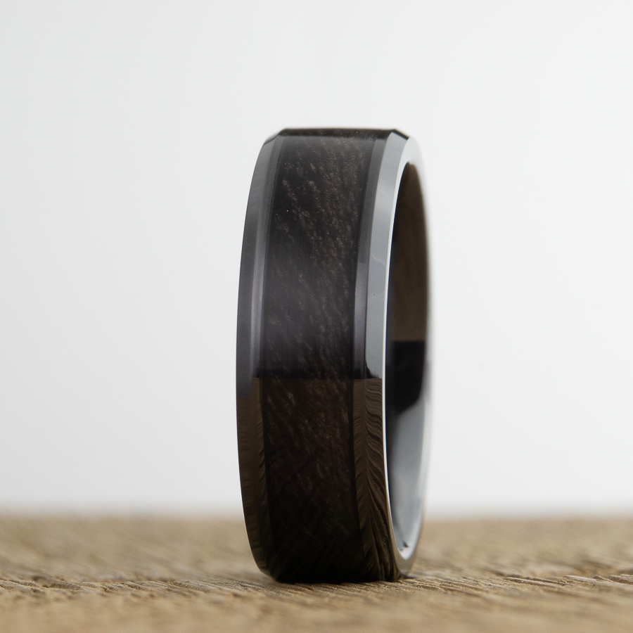 weathered barnwood wooden wedding band on black ceramic