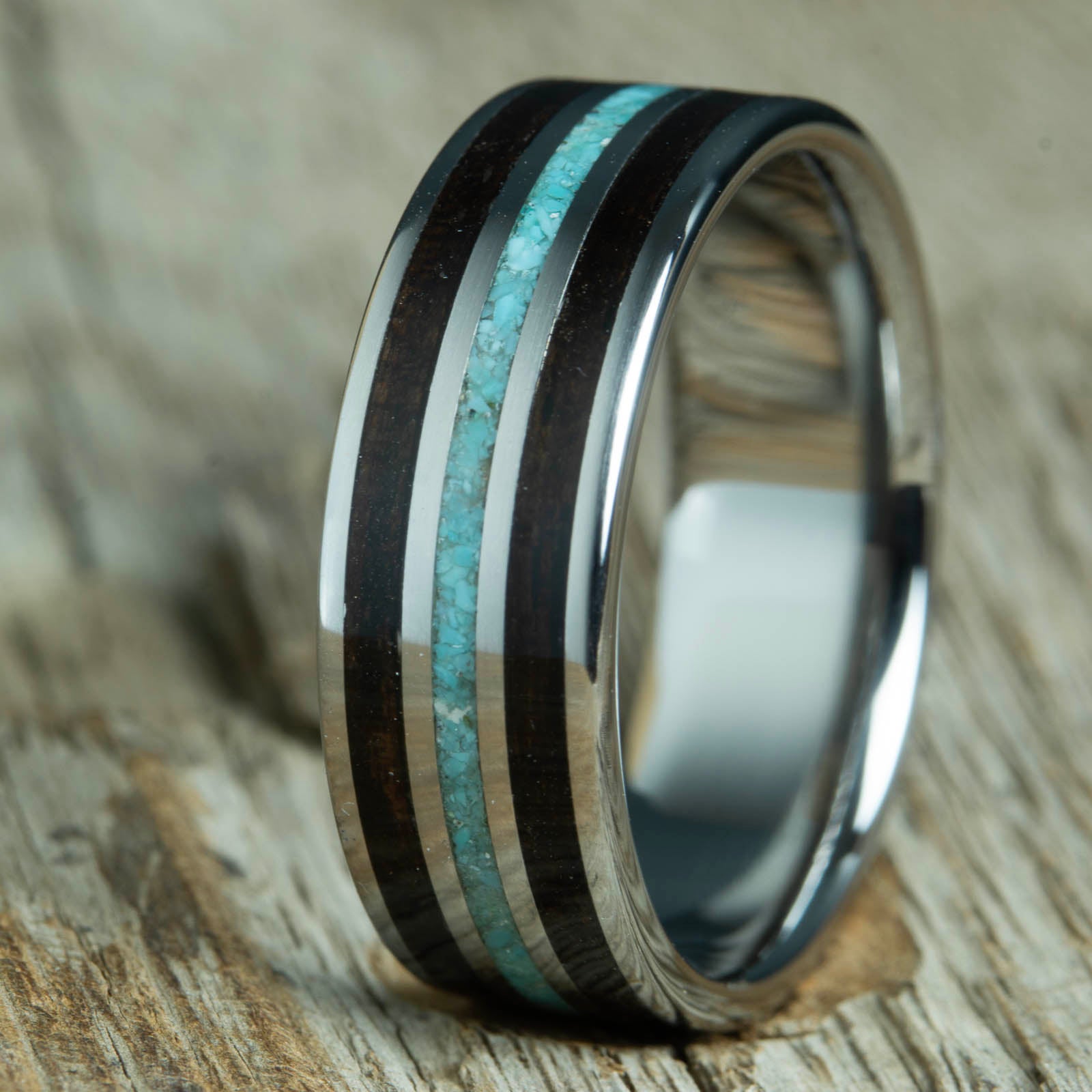 Mens wedding band with Ebony wood and turquoise inlay, polished titanium band. Custom made unique wedding rings with Ebony wood and turquoise stone inlay. Polished titanium and wood rings made by Peacefield Titanium.