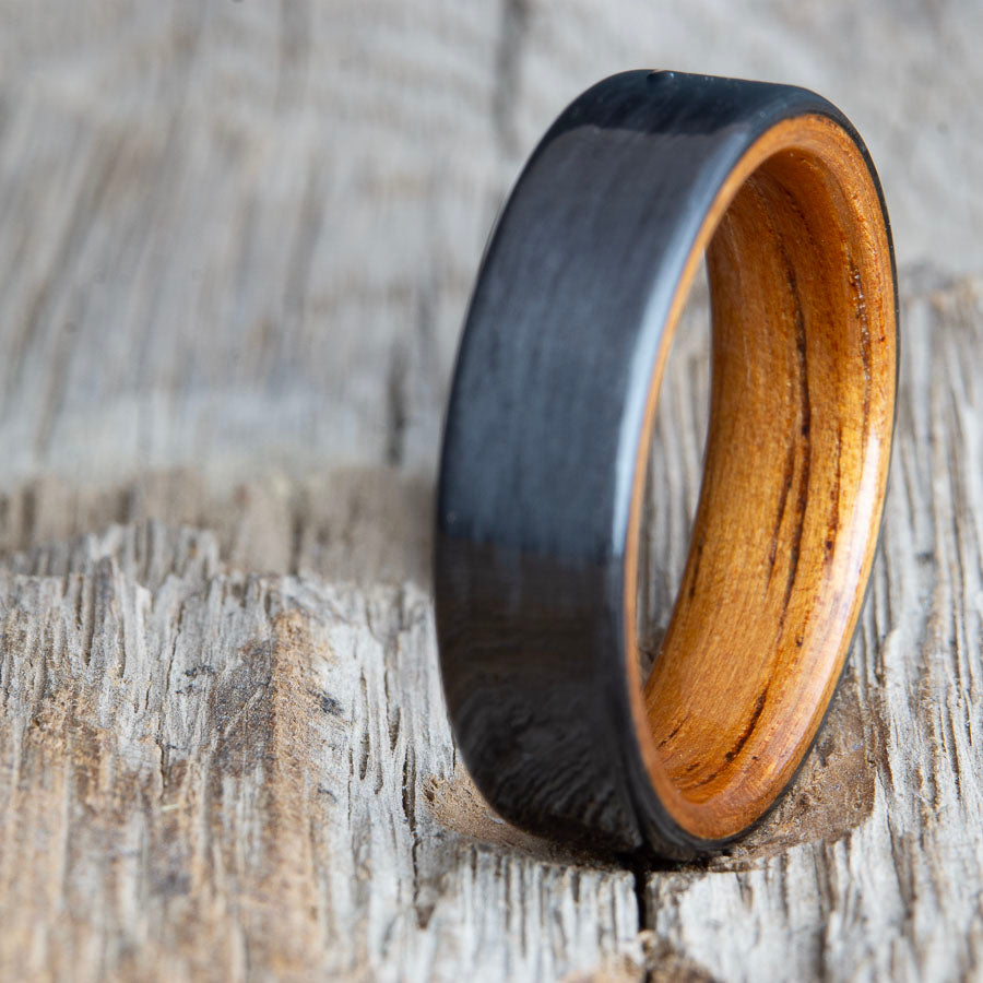 Black ring with carbon fiber and Koa wood