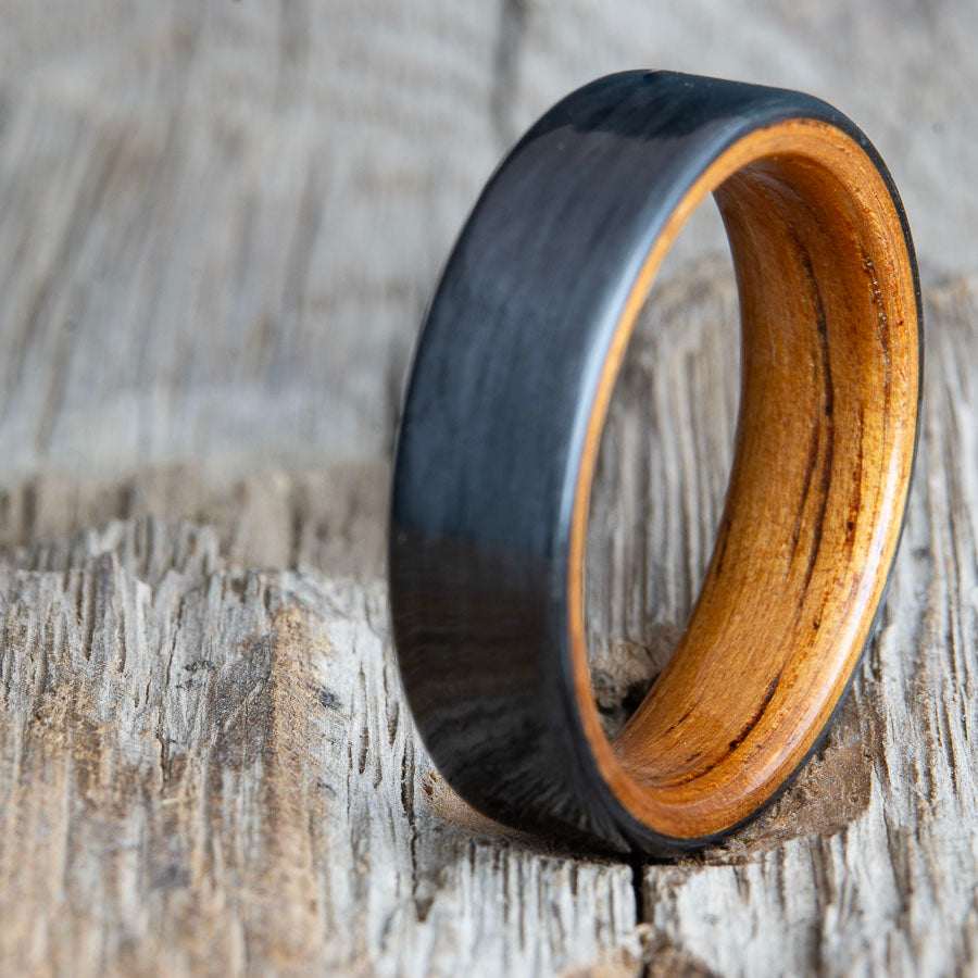 black wedding band with carbon fiber and Koa wood