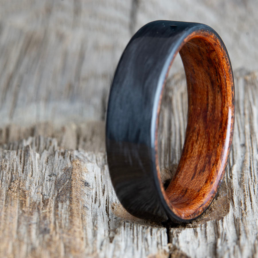 Black ring with carbon fiber and Bubinga wood