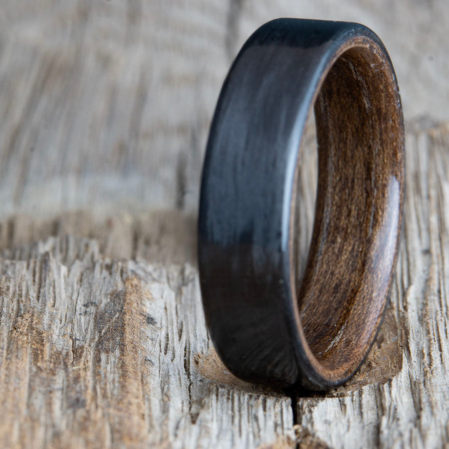 Black ring with carbon fiber and walnut wood