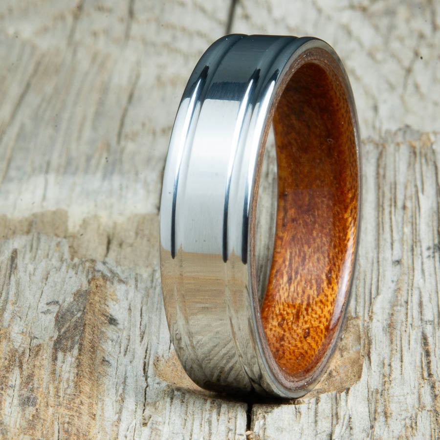 Acacia bentwood ring with polished double groove 6mm titanium. Custom bentwood wedding bands made by Peacefield Titanium