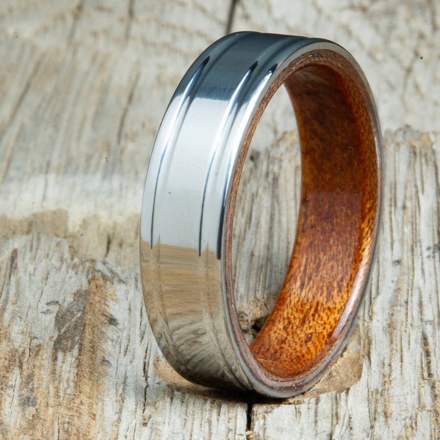 Acacia bentwood ring with polished double groove 6mm titanium. Custom bentwood wedding bands made by Peacefield Titanium