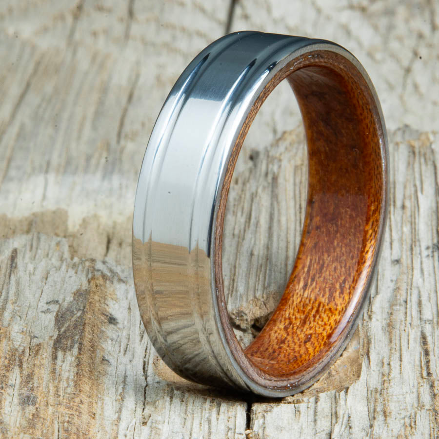 Acacia bentwood ring with polished double groove 6mm titanium. Custom bentwood wedding bands made by Peacefield Titanium