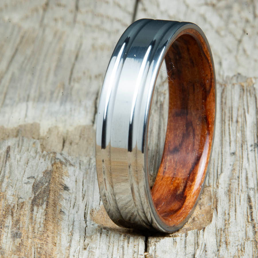 Bubinga bentwood ring with polished double groove 6mm titanium. Custom bentwood wedding bands made by Peacefield Titanium