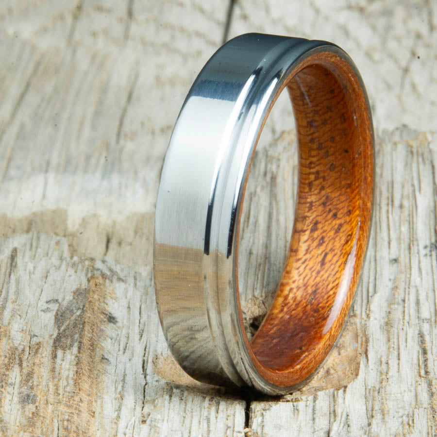 bentwood Acacia ring with polished titanium and single offset groove. Unique bentwood wedding bands made by Peacefield Titanium.