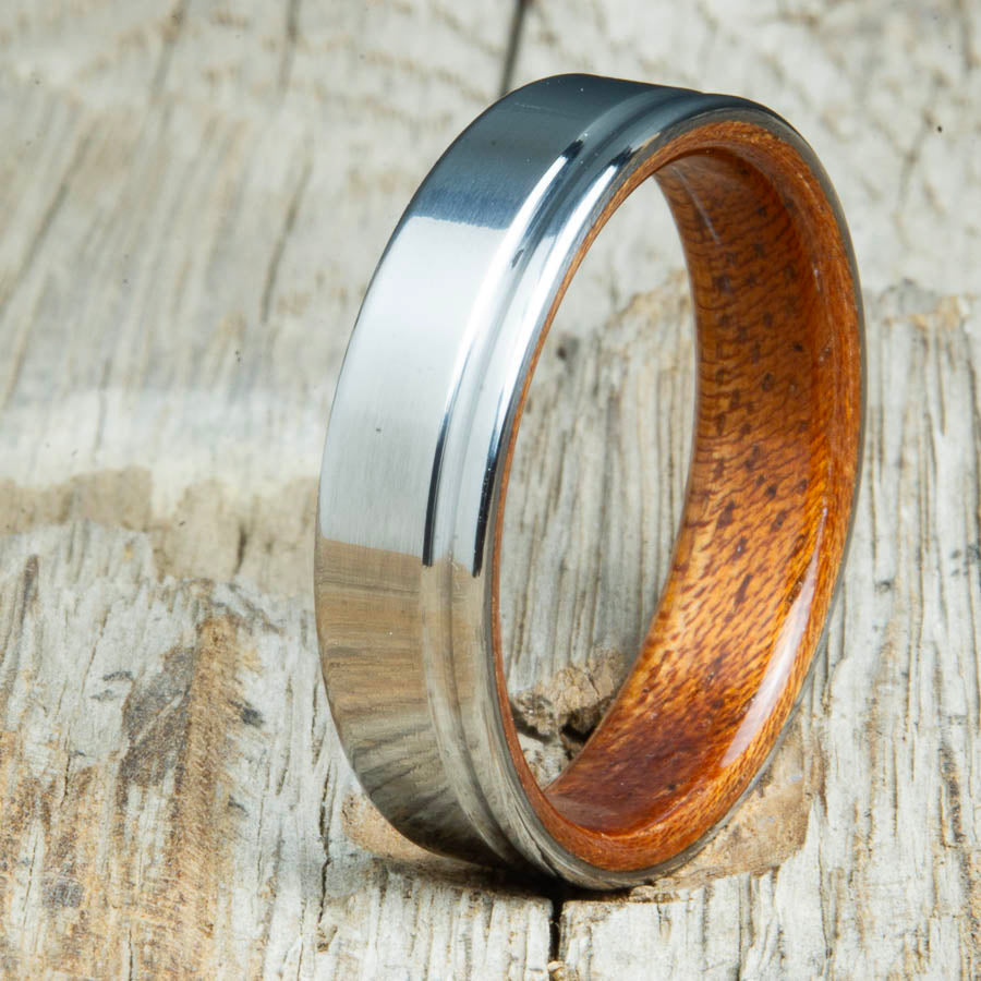 bentwood Acacia ring with polished titanium and single offset groove. Unique bentwood wedding bands made by Peacefield Titanium.