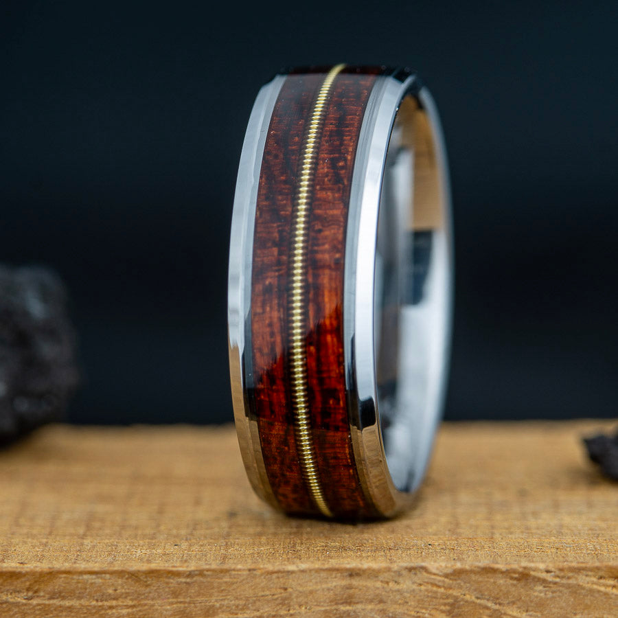 Tungsten band with guitar string and bubinga wood inlay