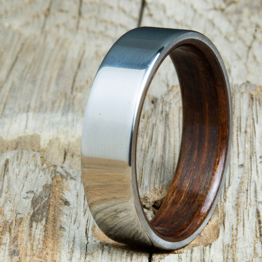 Classic titanium wood ring with Walnut wood interior. Unique titanium and wood wedding rings made by Peacefield Titanium.