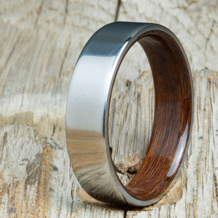 Classic titanium wood ring with Rosewood wood interior. Unique titanium and wood wedding rings made by Peacefield Titanium.