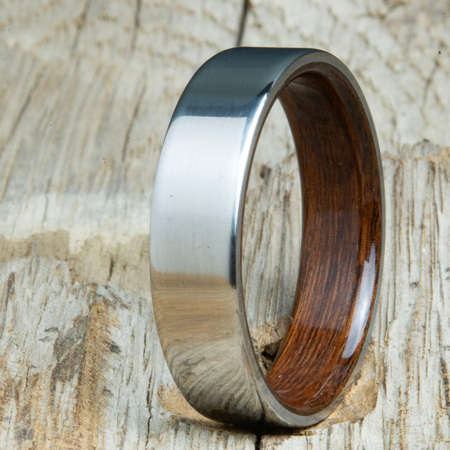 Classic titanium wood ring with Rosewood wood interior. Unique titanium and wood wedding rings made by Peacefield Titanium.