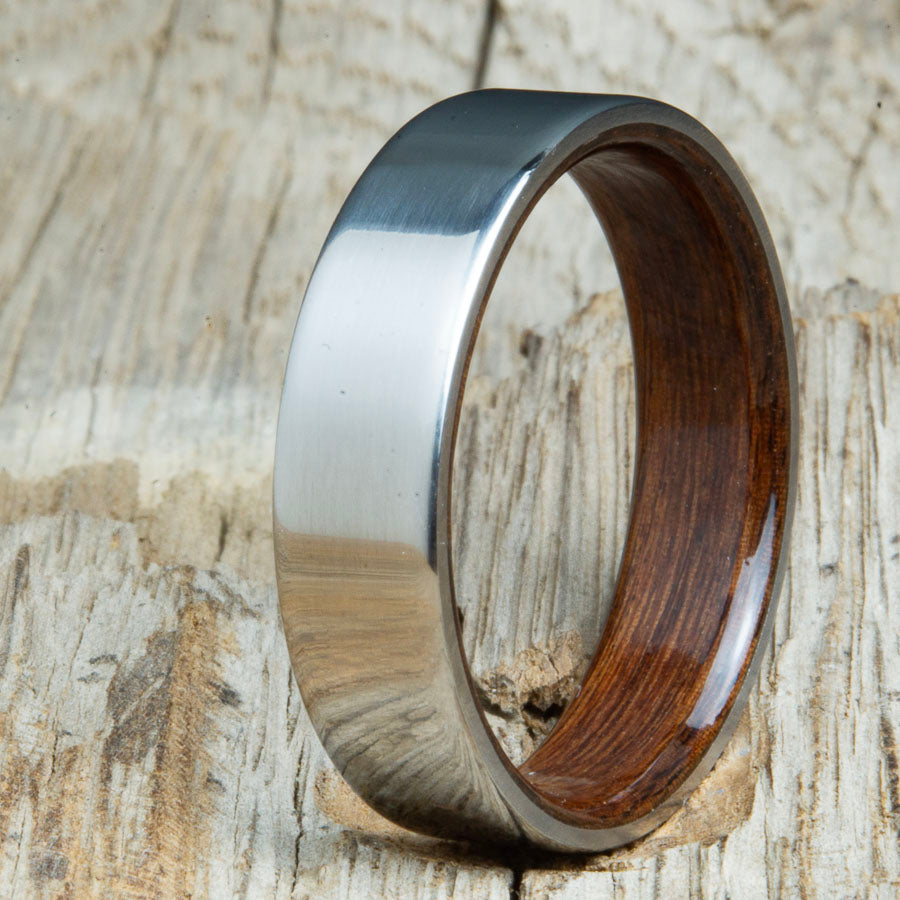 Classic titanium wood ring with Rosewood wood interior. Unique titanium and wood wedding rings made by Peacefield Titanium.