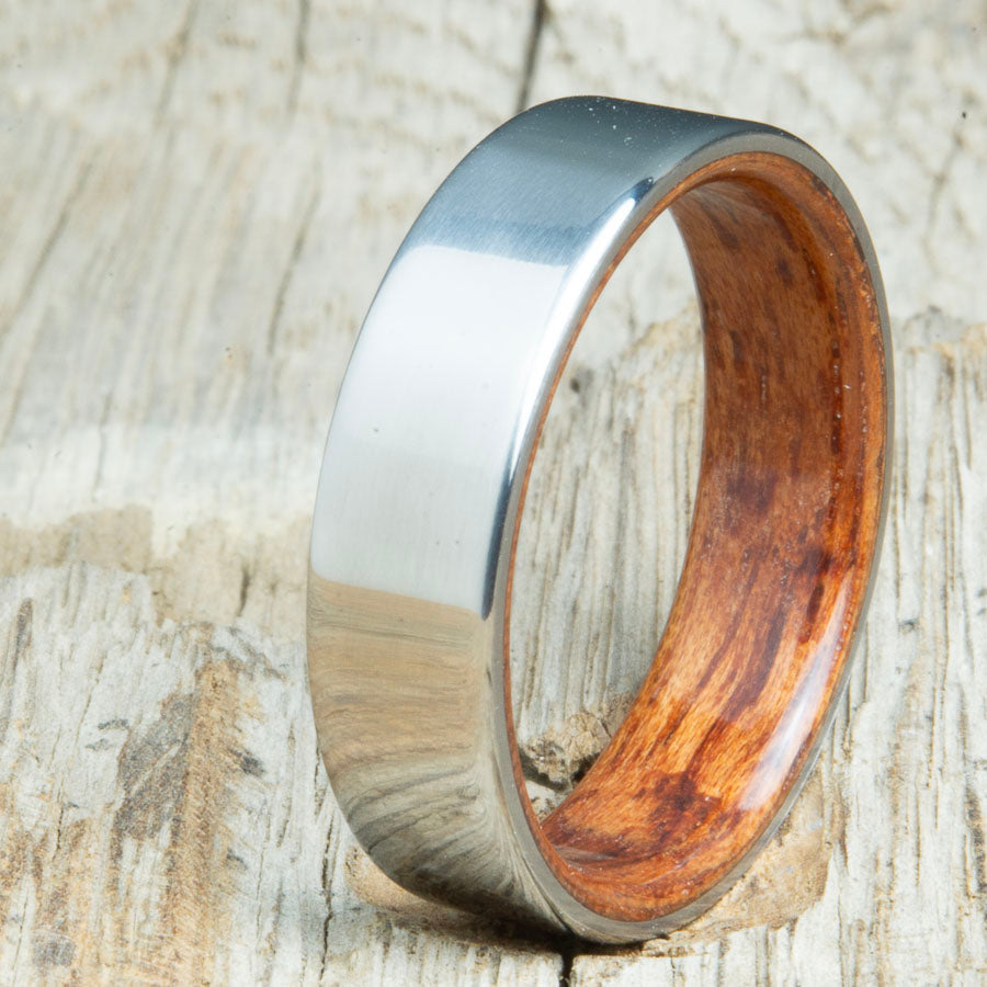 Classic titanium wood ring with Bubinga wood interior. Unique titanium and wood wedding rings made by Peacefield Titanium.