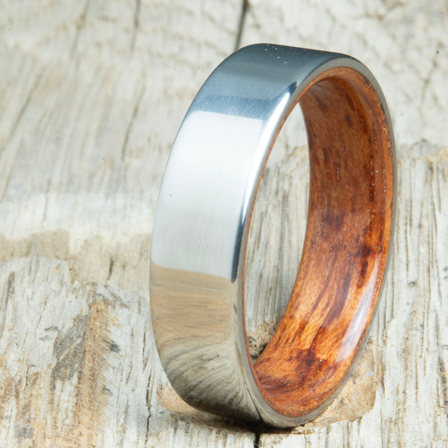 Classic titanium wood ring with Bubinga wood interior. Unique titanium and wood wedding rings made by Peacefield Titanium.