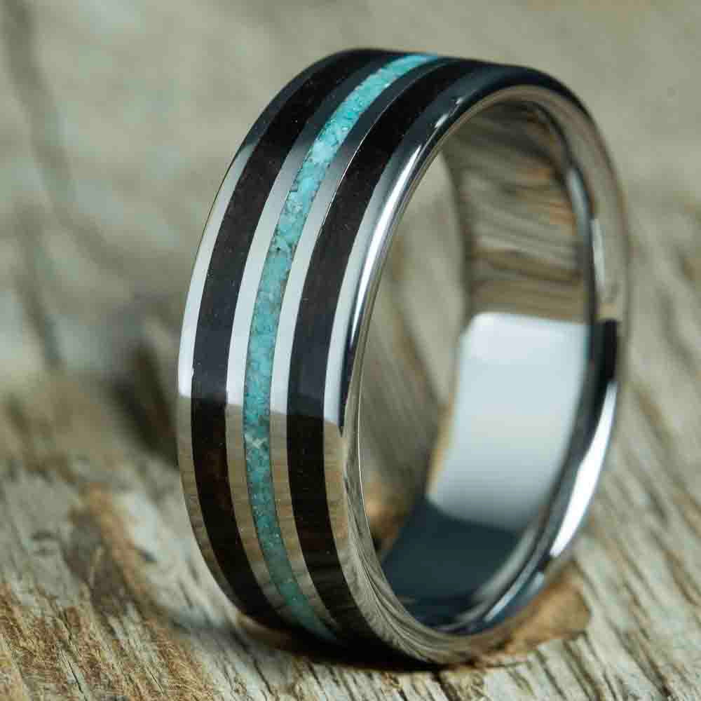 ebony and turquoise mens ring.Mens wedding band with Ebony wood and turquoise inlay, polished titanium band. Custom made unique wedding rings with Ebony wood and turquoise stone inlay. Polished titanium and wood rings made by Peacefield Titanium. Wooden rings for men