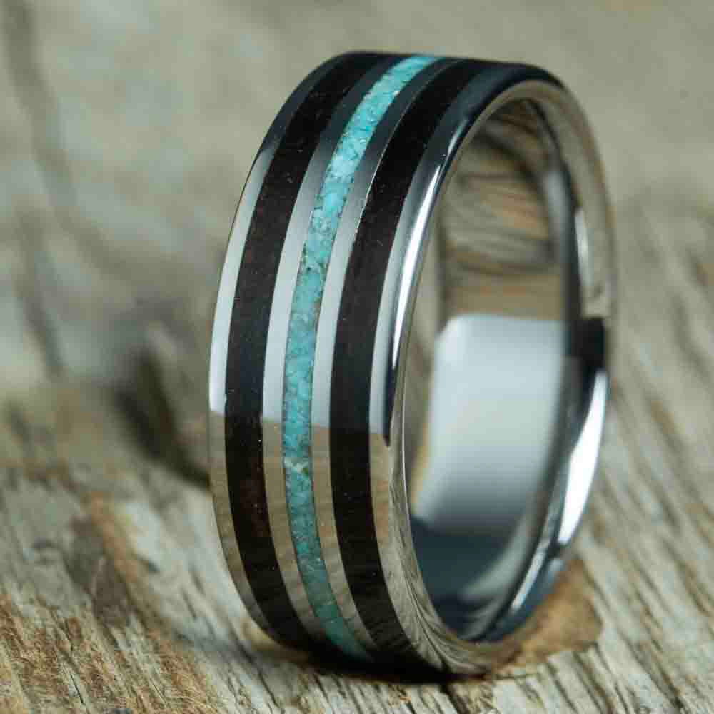 ebony and turquoise mens ring.Mens wedding band with Ebony wood and turquoise inlay, polished titanium band. Custom made unique wedding rings with Ebony wood and turquoise stone inlay. Polished titanium and wood rings made by Peacefield Titanium. Wooden rings for men