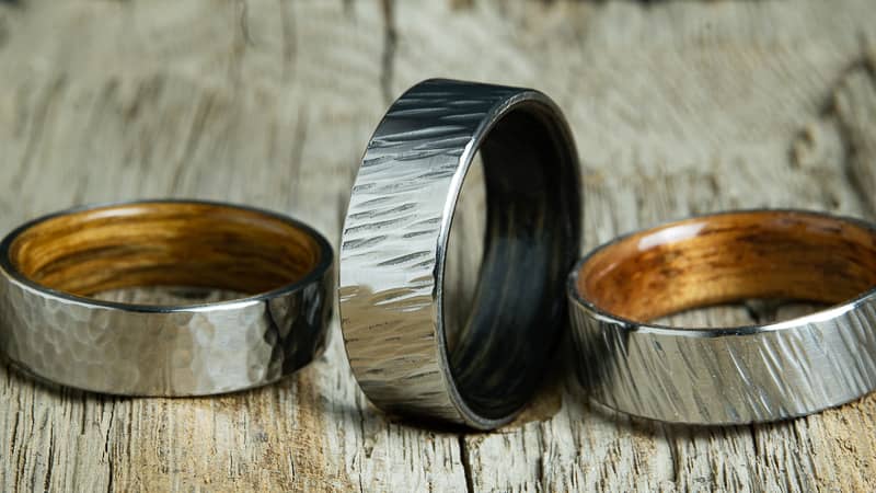 Collection of hammered rings by Peacefield Titanium, hammer finish wedding bands