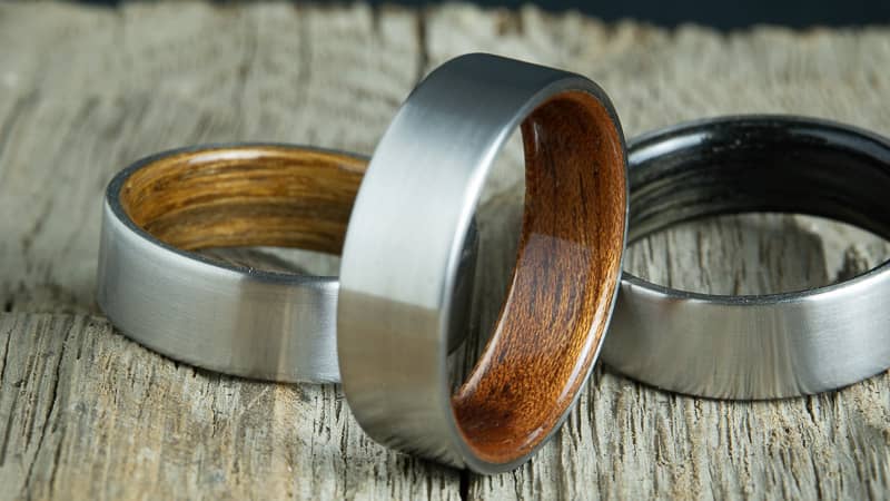 Titanium wood rings made by Peacefield Titanium, collection of custom made titanium rings with wood wedding bands