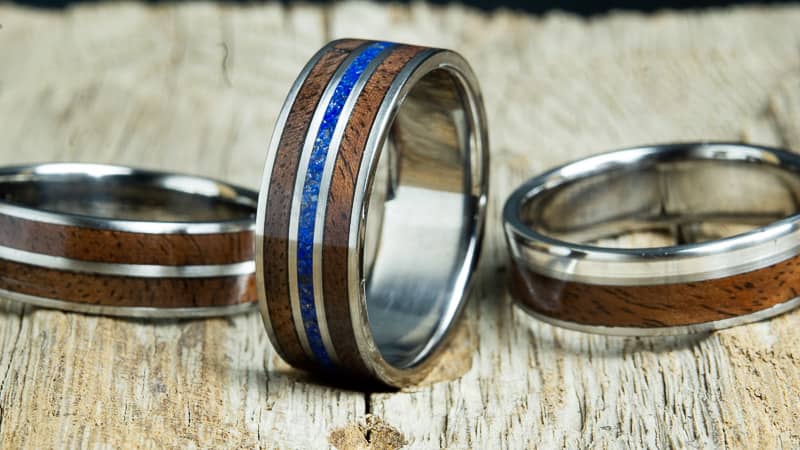 collection of rings made with reclaimed Walnut, walnut wooden rings by Peacefield Titanium