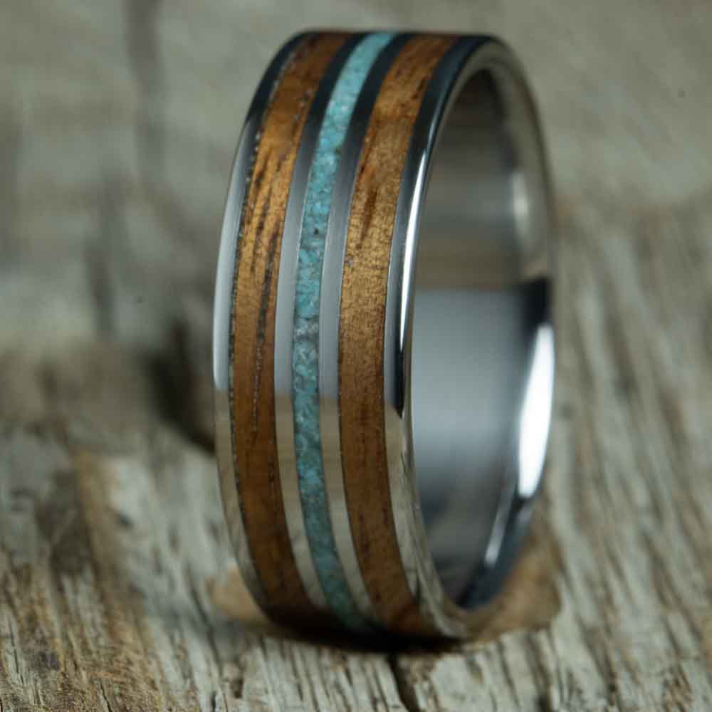 polished titanium with Koa wood and turquoise inlays