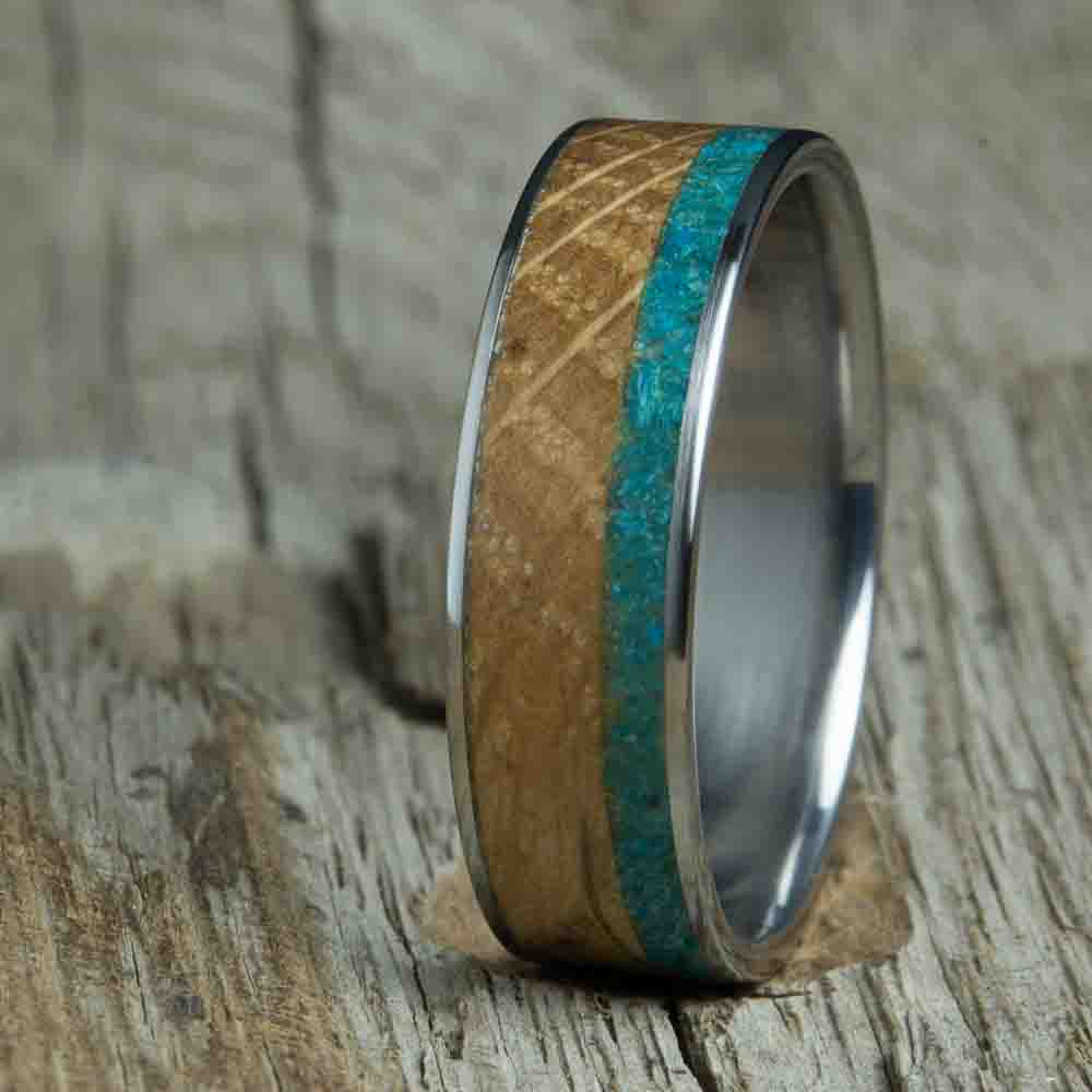 titanium ring with whiskey barrel wood and turquoise