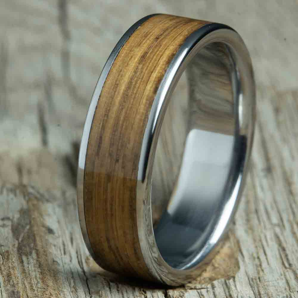 Ring with whiskey barrel wood and titanium