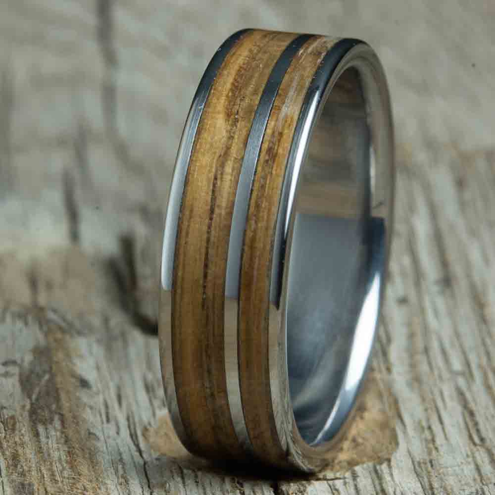 Titanium ring made with Whiskey barrel wood