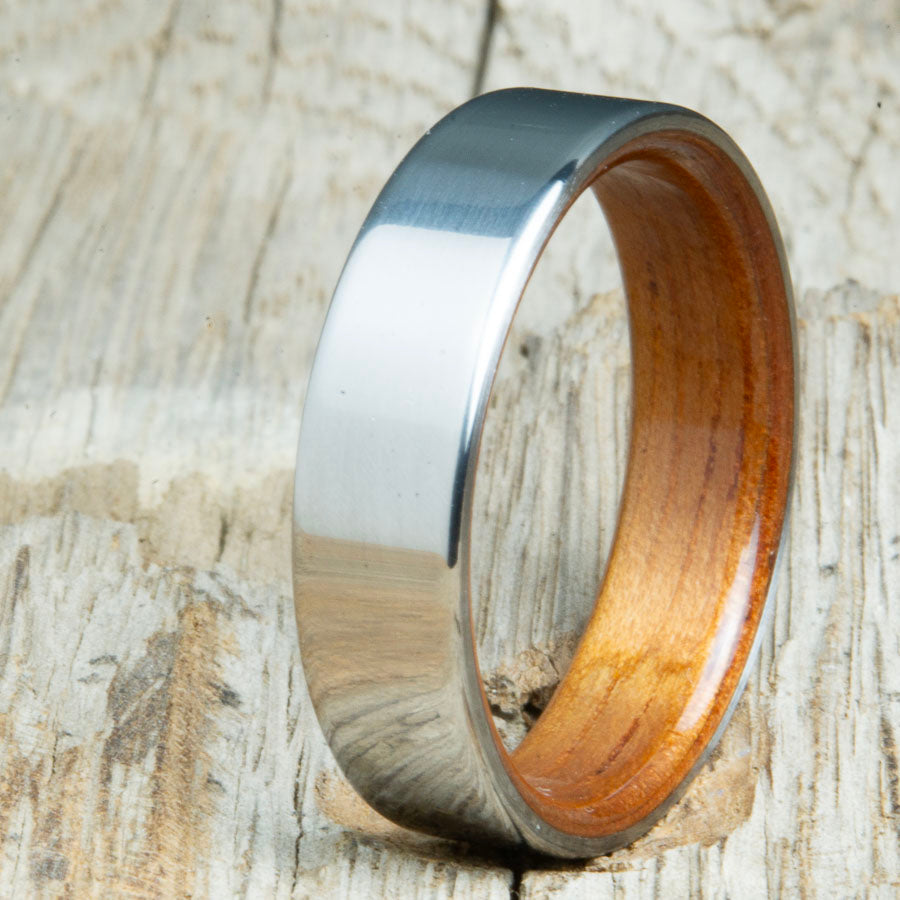 Classic mens wedding bands with Koa wood interior. Unique mens rings made by Peacefield Titanium at competitive prices