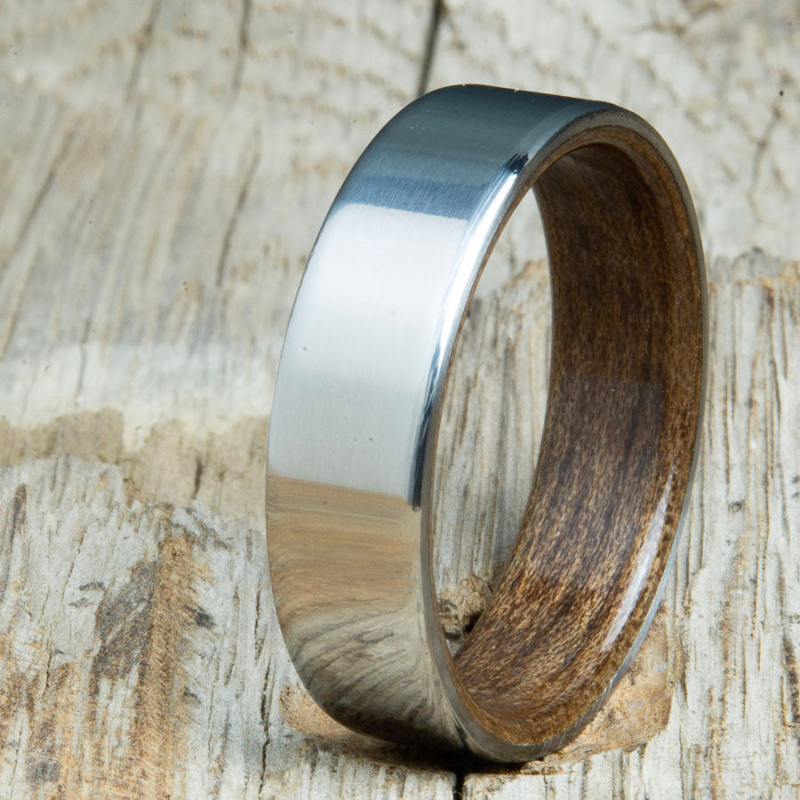 Classic mens Walnut wood wedding band with polished titanium. Custom wood rings made by Peacefield Titanium