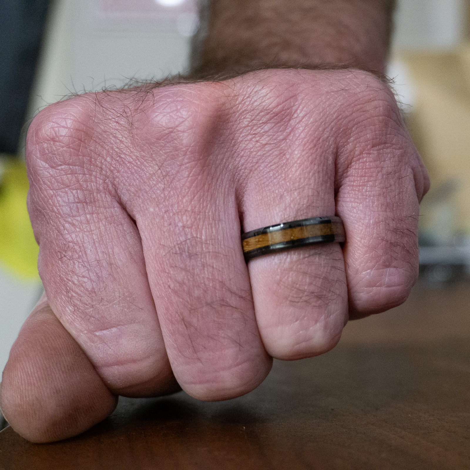 whiskey barrel wedding ring on finger