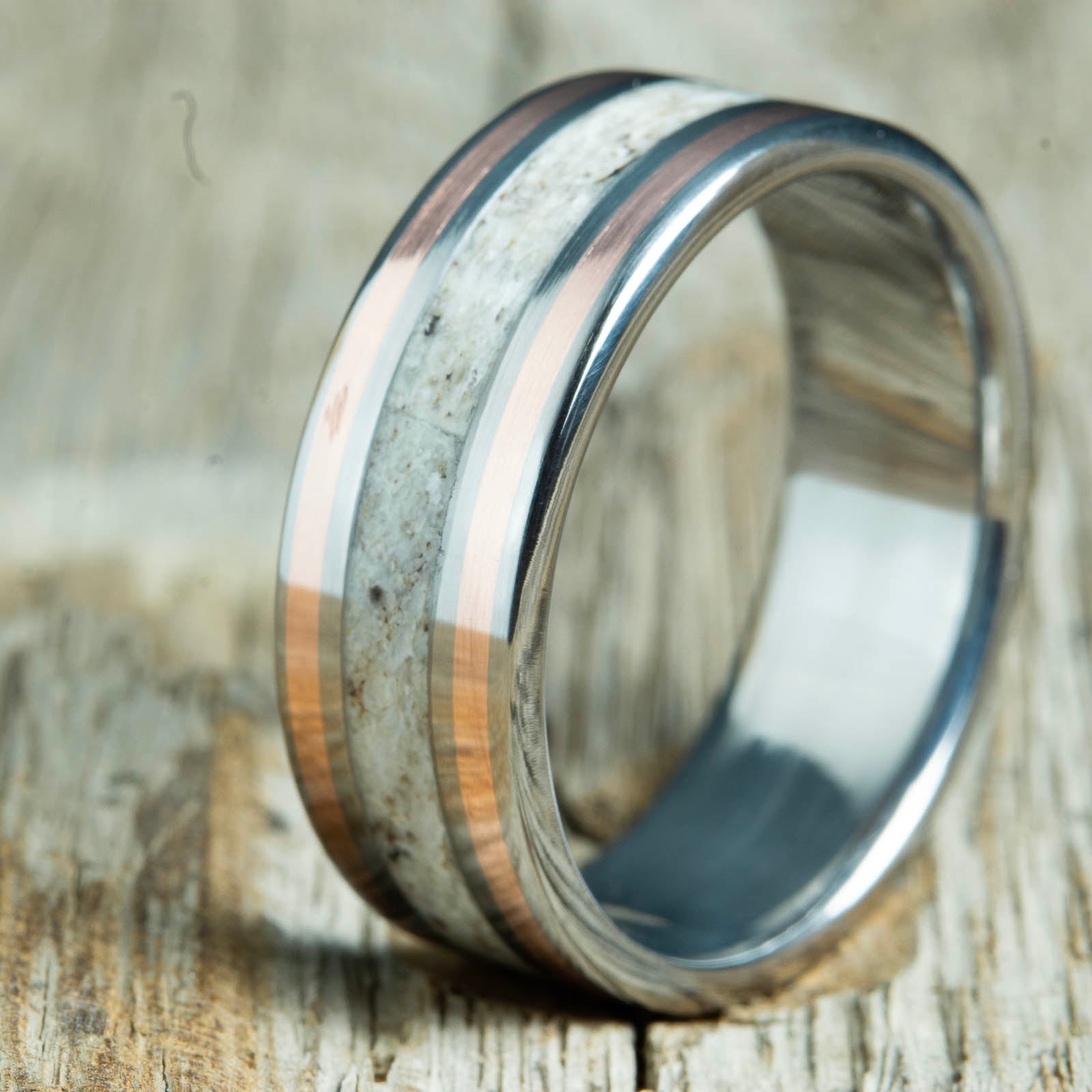 Antler ring with copper pinstripes on titanium