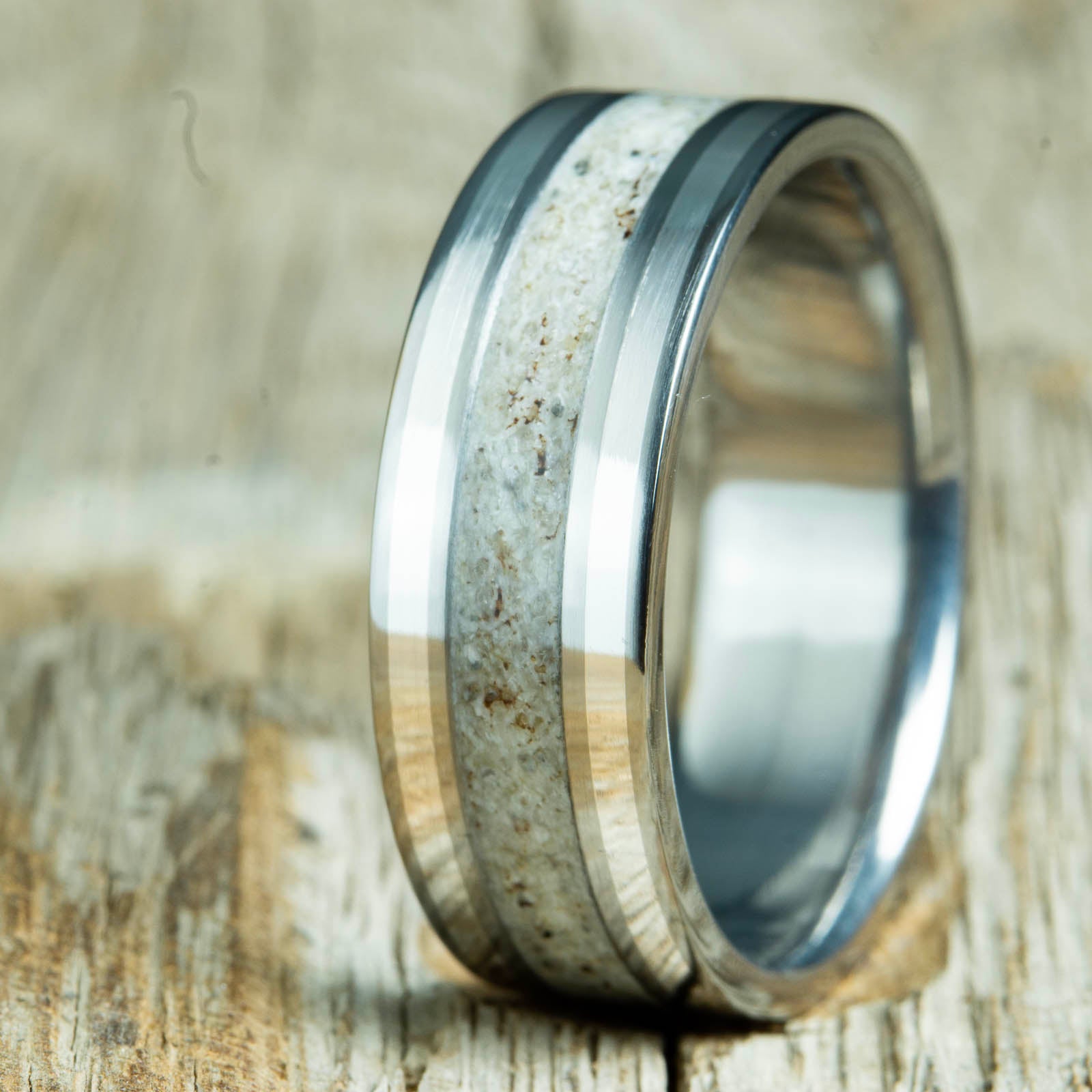 titanium ring with antler and silver pinstripe inlays