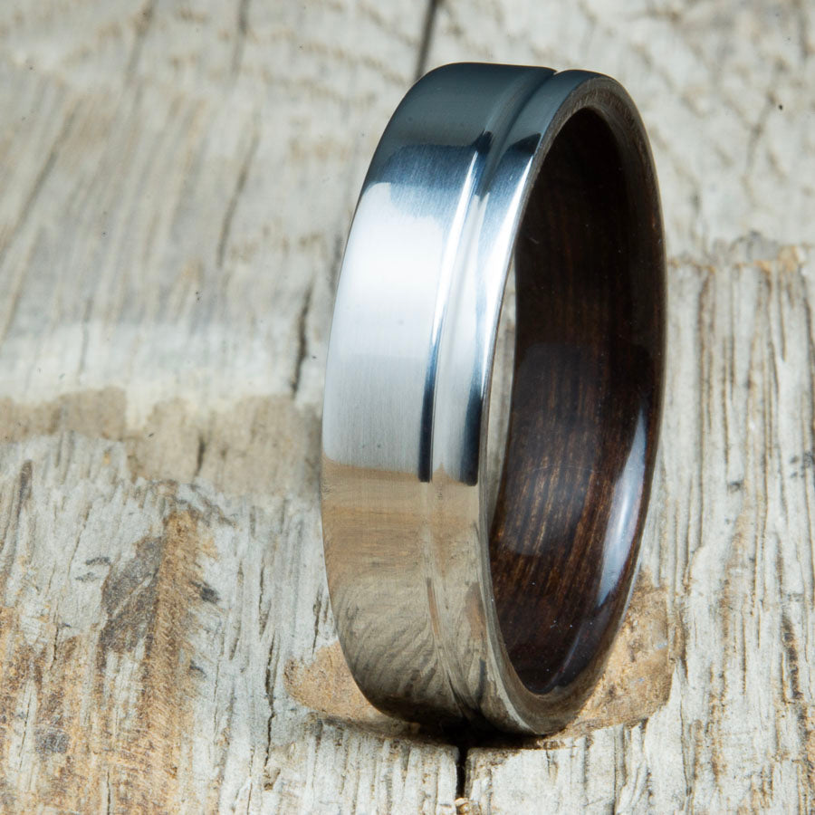 polished groove titanium and wood rings with Ebony wood. Unique handcrafted titanium wood rings made by Peacefield Titanium