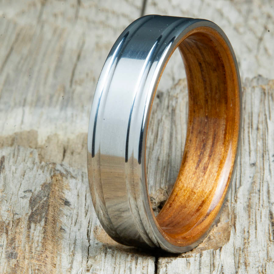 double groove polished titanium Koa wood ring. Custom unique titanium wood rings made by Peacefield Titanium