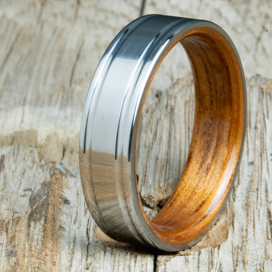 double groove polished titanium Koa wood ring. Custom unique titanium wood rings made by Peacefield Titanium