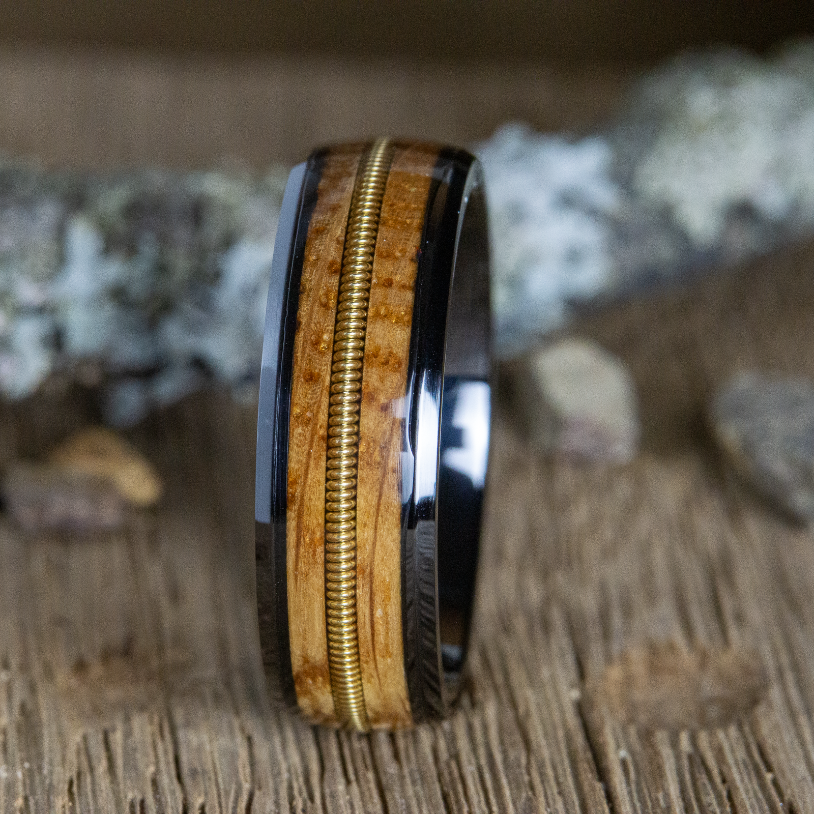 The Charlie- black whiskey barrel ring with guitar string inlay