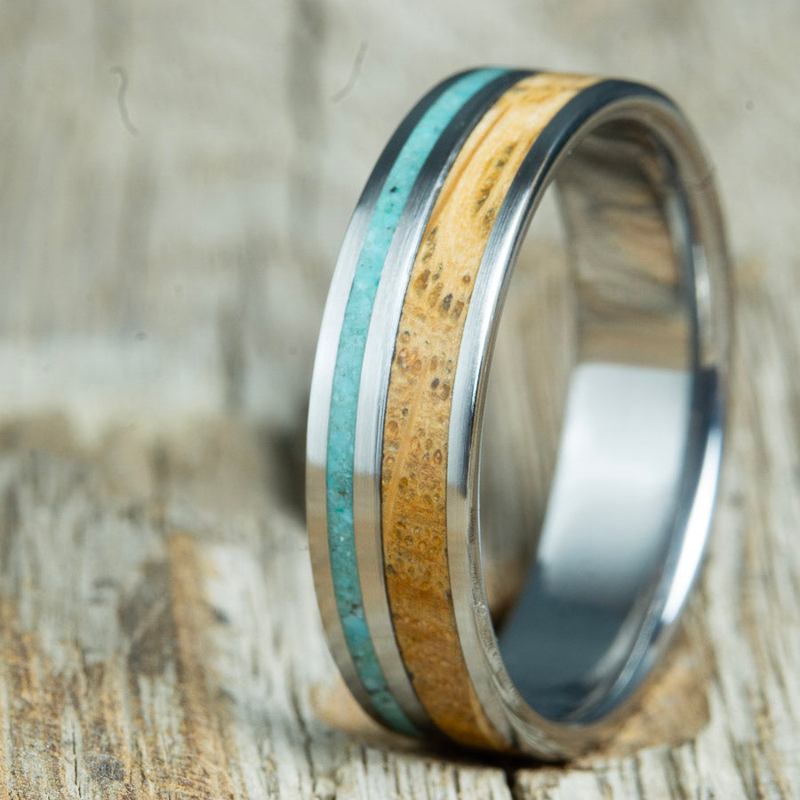ring with whiskey barrel wood and turquoise on titanium