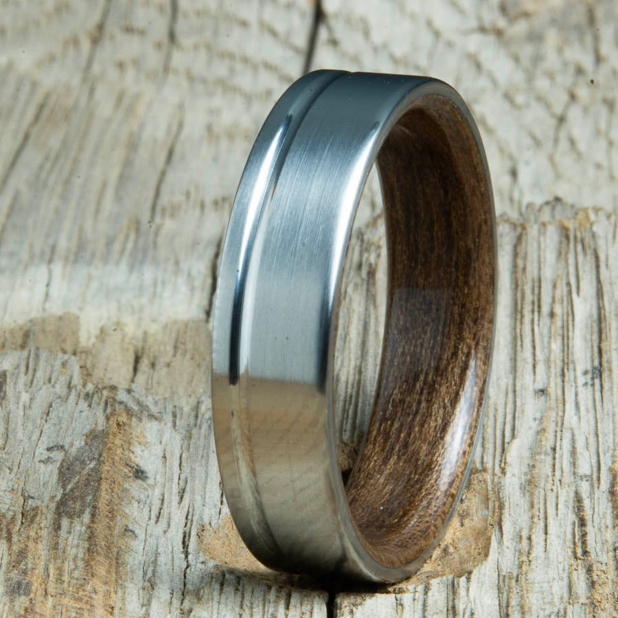 Single grooved pinstripe satin titanium mens ring with Walnut wood. Unique mens rings with wood and titanium made by Peacefield Titanium.